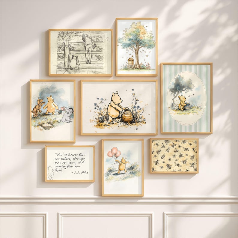 May include: A collection of framed watercolor art prints featuring Winnie the Pooh and friends. The prints showcase scenes with Pooh, Tigger, Eeyore, and Piglet, along with quotes and illustrations of bees and honey. The frames are a light wood color.