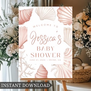Könnte beinhalten: Ein druckbares Babyparty-Schild mit Muschel-Motiv. Das Schild ist weiß mit rosa und beigefarbenen Muscheln und Korallen. Der Text lautet "Willkommen zur Babyparty von Jessica am 21. Juni 2025 in Irvine, CA".
