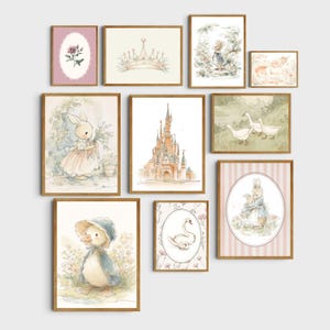 May include: A collection of framed watercolor art prints featuring whimsical illustrations. The artwork includes a castle, a crown, bunnies, a duckling, a swan, and floral elements. The color palette is soft, with pastel pinks, blues, and greens.