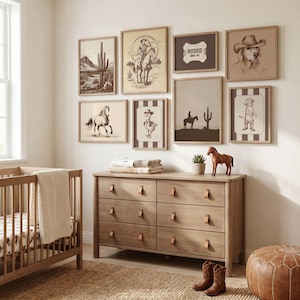 Kids room poster collage with western horse and ranch artwork in a cohesive blue themed gallery wall.