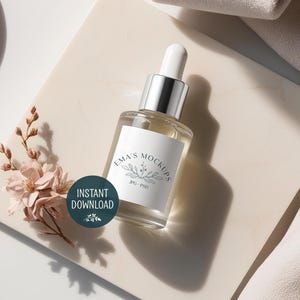 May include: A clear glass dropper bottle with a silver cap and white label, featuring the text "Ema's Mockups". The bottle sits on a cream-colored marble surface, next to a floral arrangement and a teal circle with the words "Instant Download".