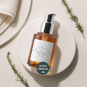 May include: A brown glass bottle with a silver pump dispenser and a white label that reads "EMA'S MOCKUPS". The bottle is on a white circular surface, with sprigs of rosemary. A green circle with the words "INSTANT DOWNLOAD" is on the bottom.