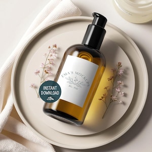 May include: A brown glass bottle with a black pump dispenser and a white label that reads "Ema's Mockups." The bottle sits on a beige plate with sprigs of pink flowers. A white towel is on the left side of the plate. A teal circle with the words "INSTANT DOWNLOAD" is on the left.