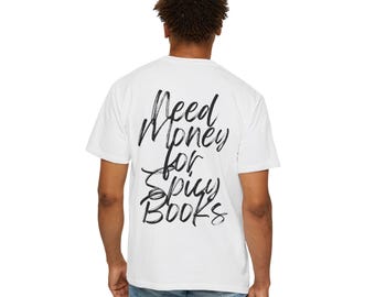 May include: White t-shirt with black text that reads "Need Money for Spicy Books" on the back.