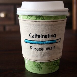 Caffeinating please wait cup cozy image 2