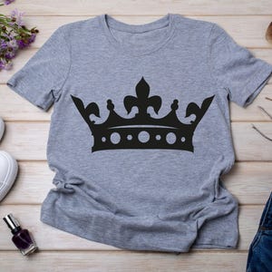 May include: A gray t-shirt with a black crown graphic.