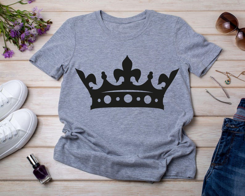May include: A gray t-shirt with a black crown graphic.