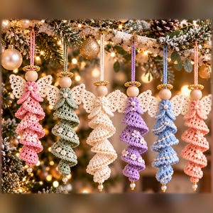 May include: Six hanging angel ornaments crafted from crochet yarn in pink, sage green, cream, lavender, light blue, and peach. Each features a wooden bead head, a gold-toned halo, white crocheted wings, and a spiraled dress with small beads.