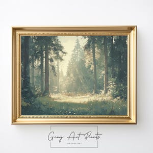 May include: A framed vintage painting depicting a forest scene with tall trees and a sunlit clearing. The painting is in a gold frame and features a soft, muted colour palette.