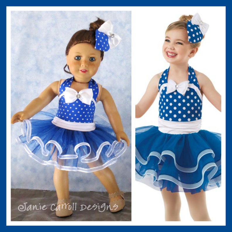 May include: A blue and white polka dot dress with a white bow and a blue tulle skirt. The dress is worn by a doll and a young girl.