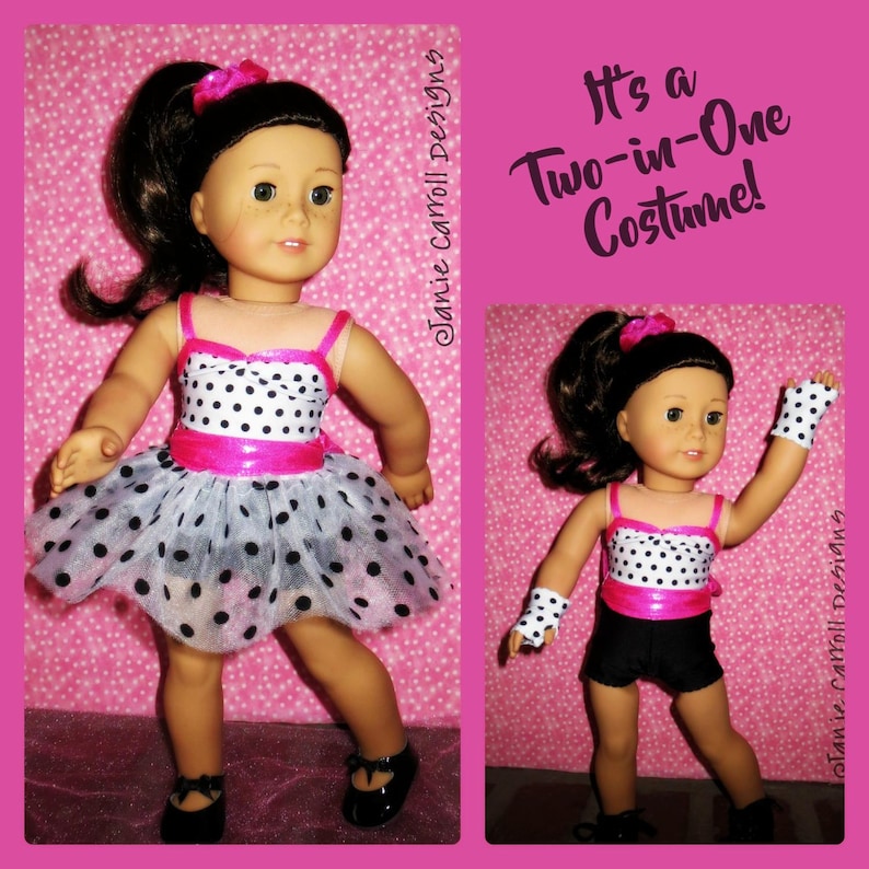 May include: A doll wearing a two-in-one costume. The costume is a black and white polka dot dress with a pink ribbon and a black and white polka dot leotard with black shorts. The doll has brown hair and brown eyes. The text "It's a Two-in-One Costume!" is written in the image.