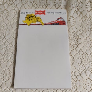 May include: A white notepad with a yellow map of the United States and a red train with the text "Ship IT on the FRISCO...the dependable one".