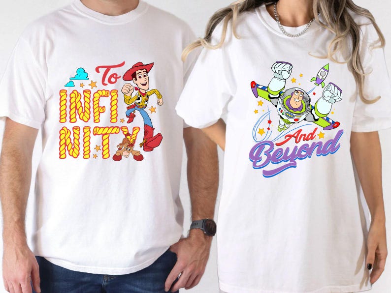 May include: Two white t-shirts with Toy Story designs. One features Woody with the words "To Infinity". The other shows Buzz Lightyear with "And Beyond". Both shirts have vibrant, colourful graphics.