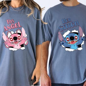 May include: Two blue t-shirts featuring cartoon characters. One has the text "His Angel" and a pink character, the other says "Her Stitch" with a blue character. Both designs appear to be breaking through a paper effect.