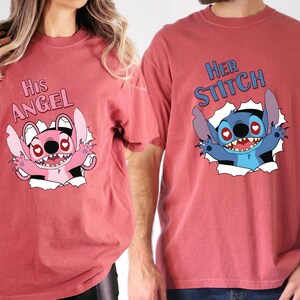 May include: Matching red t-shirts with Stitch cartoon designs. One shirt says "His Angel" with a pink Stitch, the other says "Her Stitch" with a blue Stitch. Both designs show Stitch breaking through a white background, ideal for couples.