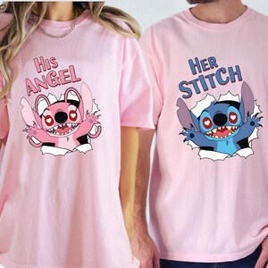 May include: Two pink t-shirts featuring cartoon graphics. One shirt says "His Angel" with a pink cartoon character. The other says "Her Stitch" with a blue cartoon character. Both characters are bursting through a torn paper effect.