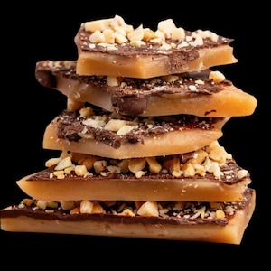 English toffee covered with chocolate and chopped roasted almonds.