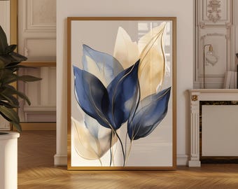 May include: A framed art print featuring watercolor leaves in shades of navy blue, gold, and cream. The botanical artwork has a gold frame and is displayed against a neutral background, adding a touch of elegance to any space.