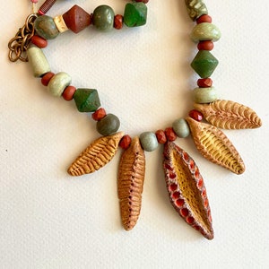 Leaves and Pods Necklace Golden Brown Ceramic Leaf Dangles w Green Ceramic Beads Red Jasper and Old Red and Green Glass Rustic Boho Jewelry
