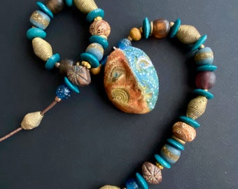 Earth Sea Face Necklace Hand Painted Woman's Pottery Face Half Blue and Silver Half Brown and Gold w Rustic, Earthy Beads  OOAK Boho Jewelry