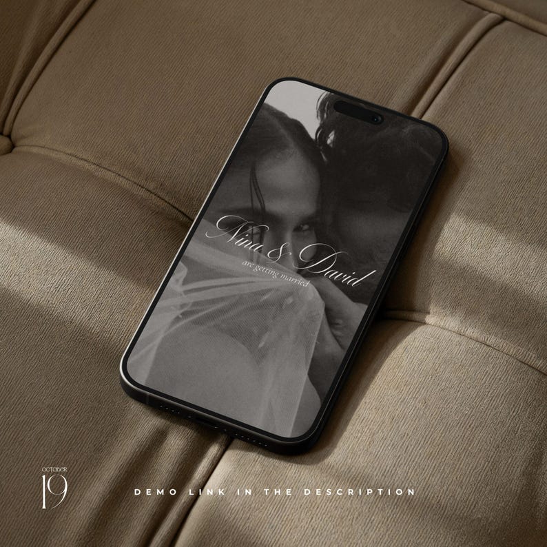 May include: A black smartphone displaying a grayscale wedding invitation graphic with the text Nina & David are getting married. The screen also features the date October 19 and the text demo link in the description at the bottom of the display.