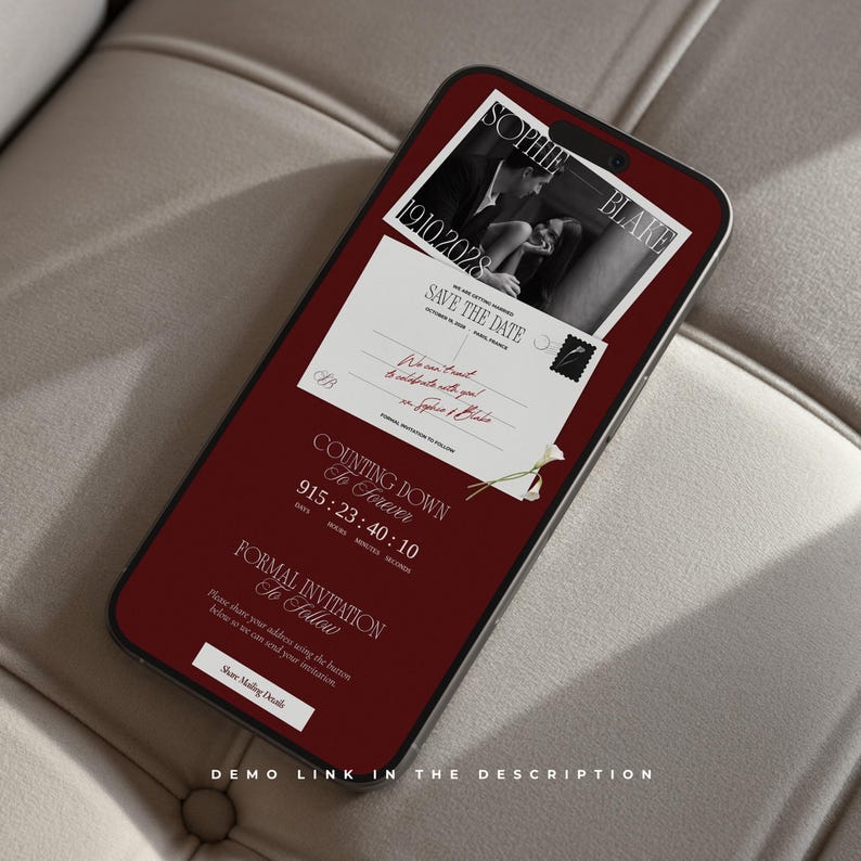 May include: A smartphone displaying a digital save the date invitation on a deep red background. The screen features a black and white photo of a couple, the names Sophie and Blake, the date 19.10.2028, a countdown timer, and a button labeled Share Mailing Details.