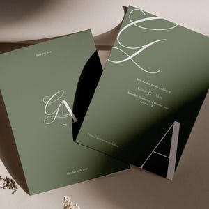 May include: Two olive green wedding invitations with white text. One card features the initials "GA" and the text "Save our date." The other card reads "Save the date for the wedding of Gina & Alex" and "October 19th, 2030."