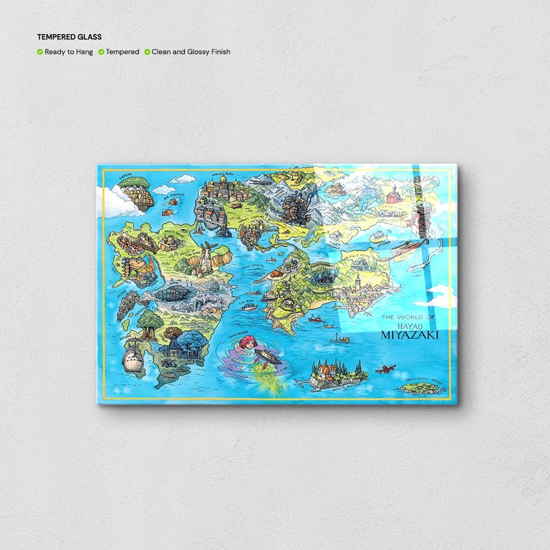 May include: Tempered glass art print showing a detailed, colourful map of a fantasy world. The map depicts castles, forests, and islands, with the text "THE WORLD OF HAYAO MIYAZAKI". The print has a clean and glossy finish.