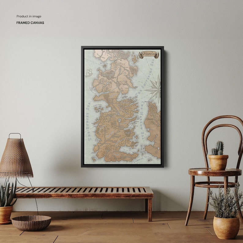 May include: A framed canvas print of a map of Westeros, a fictional continent from the popular fantasy series Game of Thrones. The map is in a vintage style with brown and beige colors and includes the names of various locations.