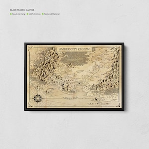 May include: A framed canvas print featuring a detailed map of the Amber City Region. The map, in sepia tones, includes mountain ranges, a compass rose, and the text "Amber City Region," "Red Iron Mountains," "Amber Sea," and "Eagle Peaks."