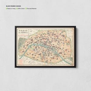 May include: A framed canvas print of a vintage map of Paris, France, in a black frame. The map features detailed illustrations of landmarks and streets, with text in French. The canvas is ready to hang and made of 100% cotton.