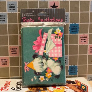 May include: A package of vintage party invitations. The invitations are teal with a cartoon illustration of two bears with party hats, a gift, and flowers. The package reads "BUZZA/CARDOZO Party Invitations 10 for 59&cent;".