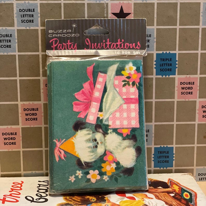 May include: A package of vintage party invitations. The invitations are teal with a cartoon illustration of two bears with party hats, a gift, and flowers. The package reads "BUZZA/CARDOZO Party Invitations 10 for 59&cent;".