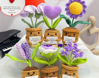 May include: Set of six crocheted flower pots with different colored flowers. Each pot has a smiling face and a sign that says "Thank you for helping me grow".