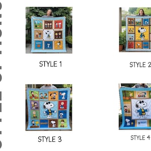 Puede incluir: Se muestran cuatro edredones con temática de Snoopy, cada uno con un diseño único. Los edredones presentan a Snoopy y otros personajes de Peanuts en varias escenas, sobre un fondo azul. Se incluye el texto "STYLE OPTIONS".