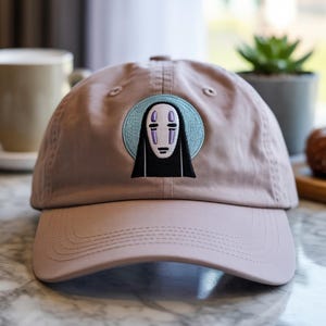 Minimalist Spirit Mask Embroidered Cap – Anime-Inspired Aesthetic Baseball Hat – Adjustable Cotton Dad Hat with Subtle Japanese Vibes
