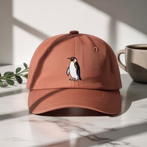 Minimalistisk pingvinsilhuett broderad hatt