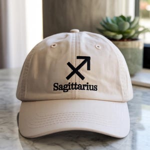 Sagittarius Glyph Embroidery Hat – Sleek Zodiac Style for November Birthdays