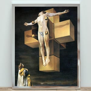 May include: A framed print of a surrealist painting. The artwork depicts a figure on a geometric cross, with a dark background and a figure in the foreground. The cross is made of golden cubes, and the figure is nude. The painting has a surreal and symbolic theme.