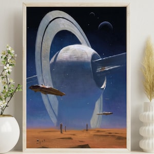 May include: A framed print depicting a futuristic space scene. A large, ringed space station dominates the background, with spacecraft and a desert landscape in the foreground. The color palette includes shades of blue, orange, and brown.