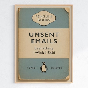 May include: Framed print featuring a vintage Penguin Books cover design. The artwork displays the title "Unsent Emails" with the subtitle "Everything I Wish I Said." A penguin illustration is centered below the text, with "Typed" and "Deleted" on either side.