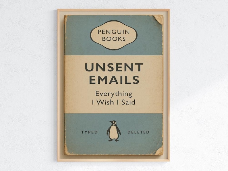 May include: Framed print featuring a vintage Penguin Books cover design. The artwork displays the title "Unsent Emails" with the subtitle "Everything I Wish I Said." A penguin illustration is centered below the text, with "Typed" and "Deleted" on either side.
