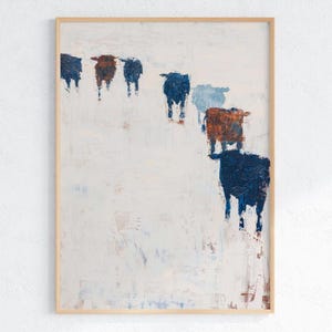 May include: Abstract art print depicting a herd of cattle in blue and brown hues on a white backdrop. The artwork is presented in a natural wood frame. The painting has a textured, brushstroke effect, adding a rustic feel to the piece.