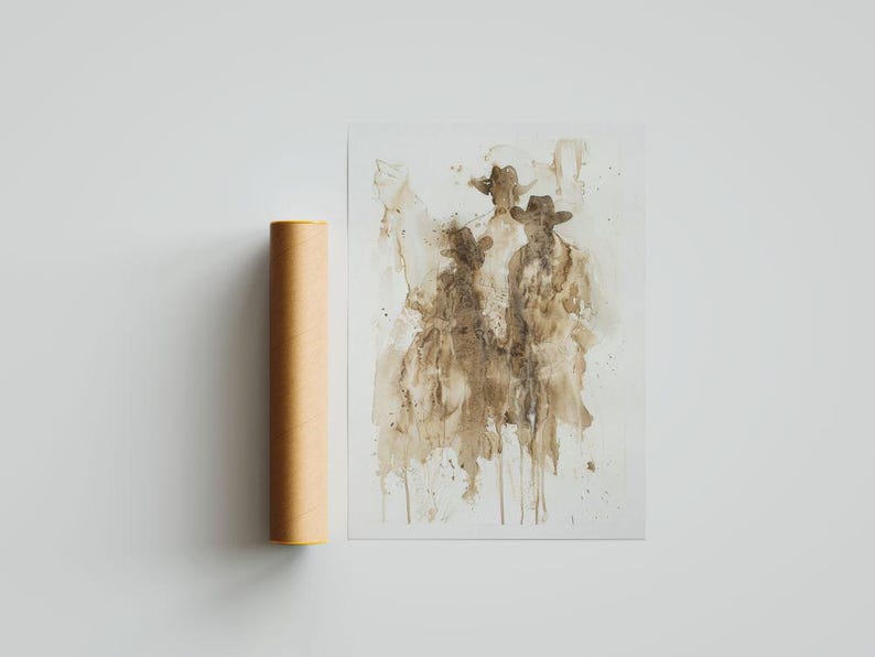 May include: Abstract art print depicting three figures in cowboy hats, in brown and beige tones. The artwork is on a white background, with a rolled-up poster tube beside it.