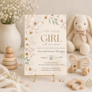 Puede incluir: Una tarjeta de invitación rectangular para baby shower con ilustraciones en acuarela de mariposas y flores en tonos beige y verde suaves. El texto dice: a little butterfly GIRL will soon arrive, Ava and Lucas Morgan, Sunday August 10, 12-3 PM.
