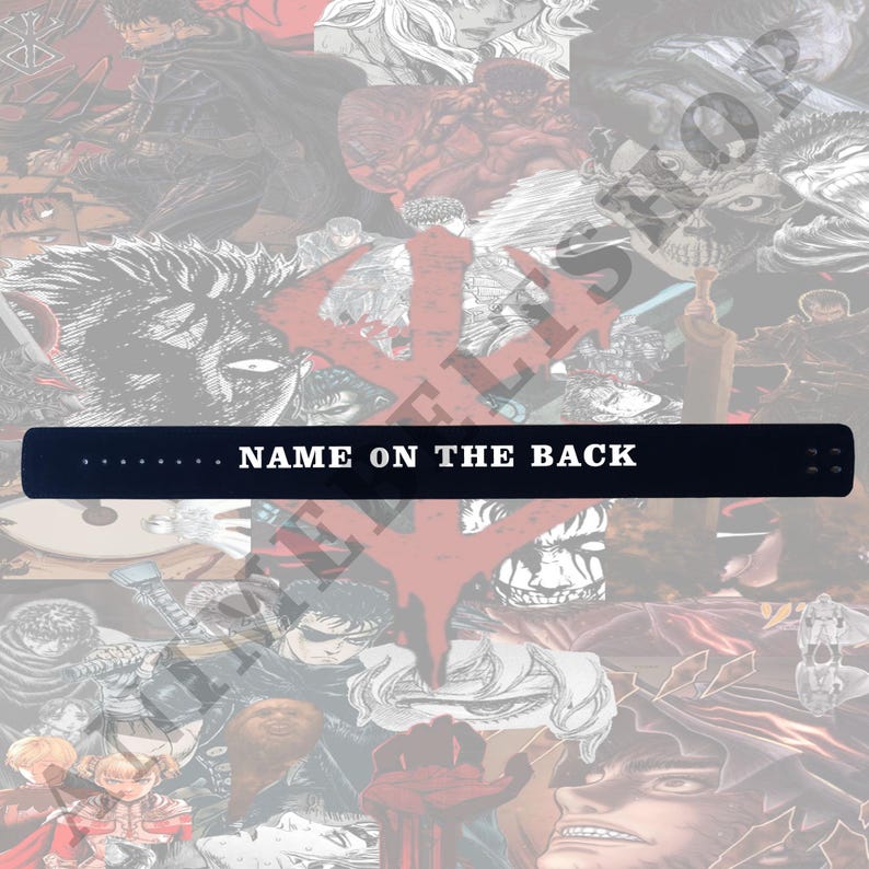 May include: A black leather wristband with white stitching and the text "NAME ON THE BACK" printed in white.