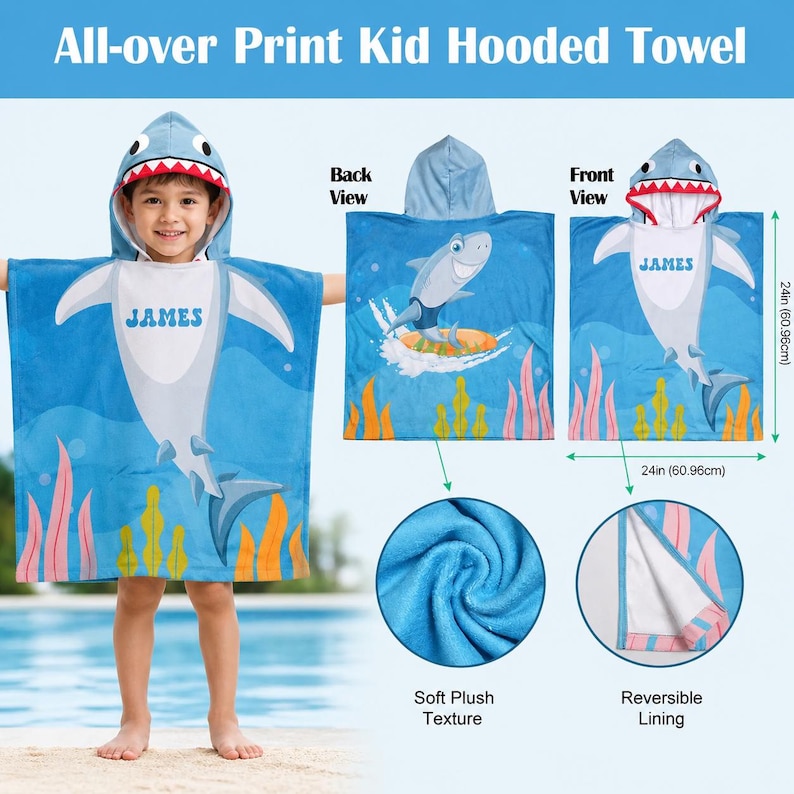 May include: A blue hooded kid's towel with a shark design. The towel features a shark face hood, a shark graphic, and the name "JAMES". The towel is 24 inches (60.96 cm) wide and has a soft plush texture.