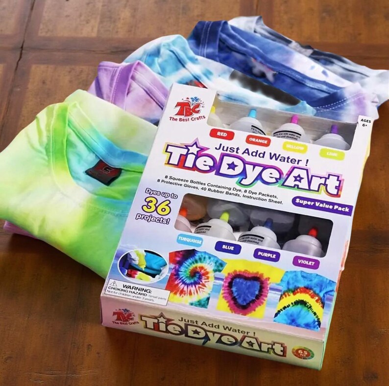 Just Add Water tie-dye art kit with dye bottles and folded T-shirts in pastel and rainbow colors for creative craft projects.