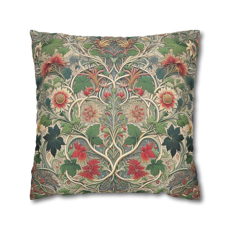 This pillow features a rich, intricate floral pattern inspired by the Arts and Crafts movement, reminiscent of William Morris designs. The artwork displays interwoven vines and stems creating a symmetrical composition, filled with lush green leaves, large red blooms, and cream-toned flowers with red centers. The background has muted, earthy tones—beige and sage—giving the overall look a vintage, classic, and elegant aesthetic.