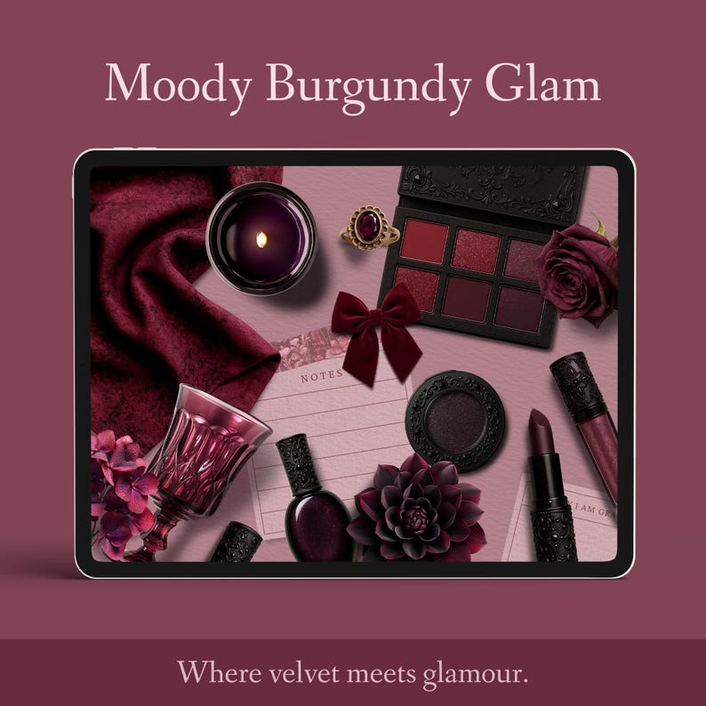 May include: A digital tablet showcases burgundy-themed beauty products. The image includes an eyeshadow palette, lipstick, nail polish, a ring, a bow, a candle, and a decorative flower. The text "Moody Burgundy Glam" is at the top of the image.